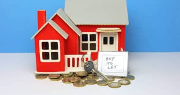 model house with keys with buy to let sign